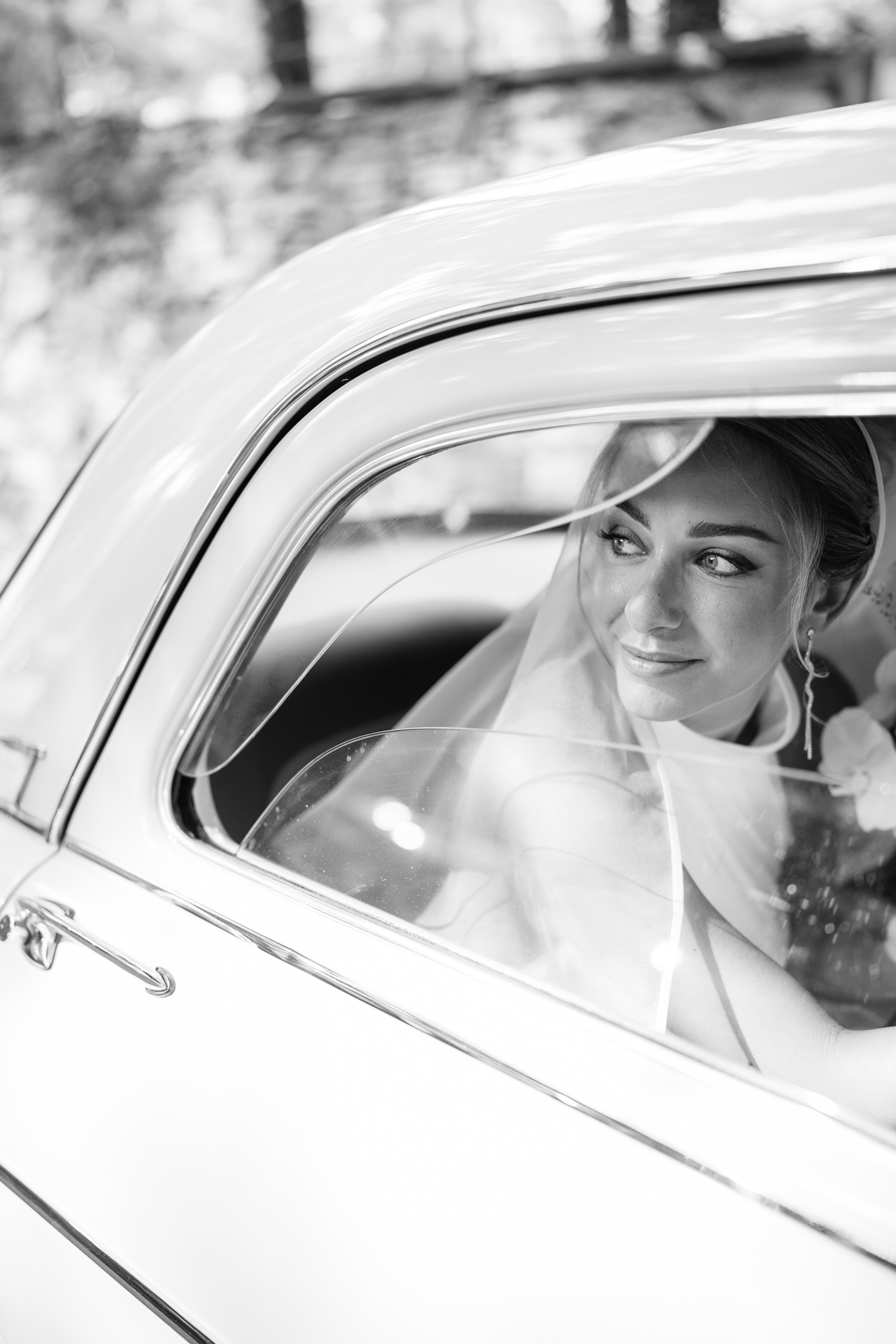 Elegant wedding in Portofino, with a view of the Ligurian bay, celebration at the historic Vesta Portofino by Dolce & Gabbana venue, capturing the atmosphere of the Dolce Vita and the Italian Riviera, bride with bouquet going to the cerimony in Portofino by vintage car