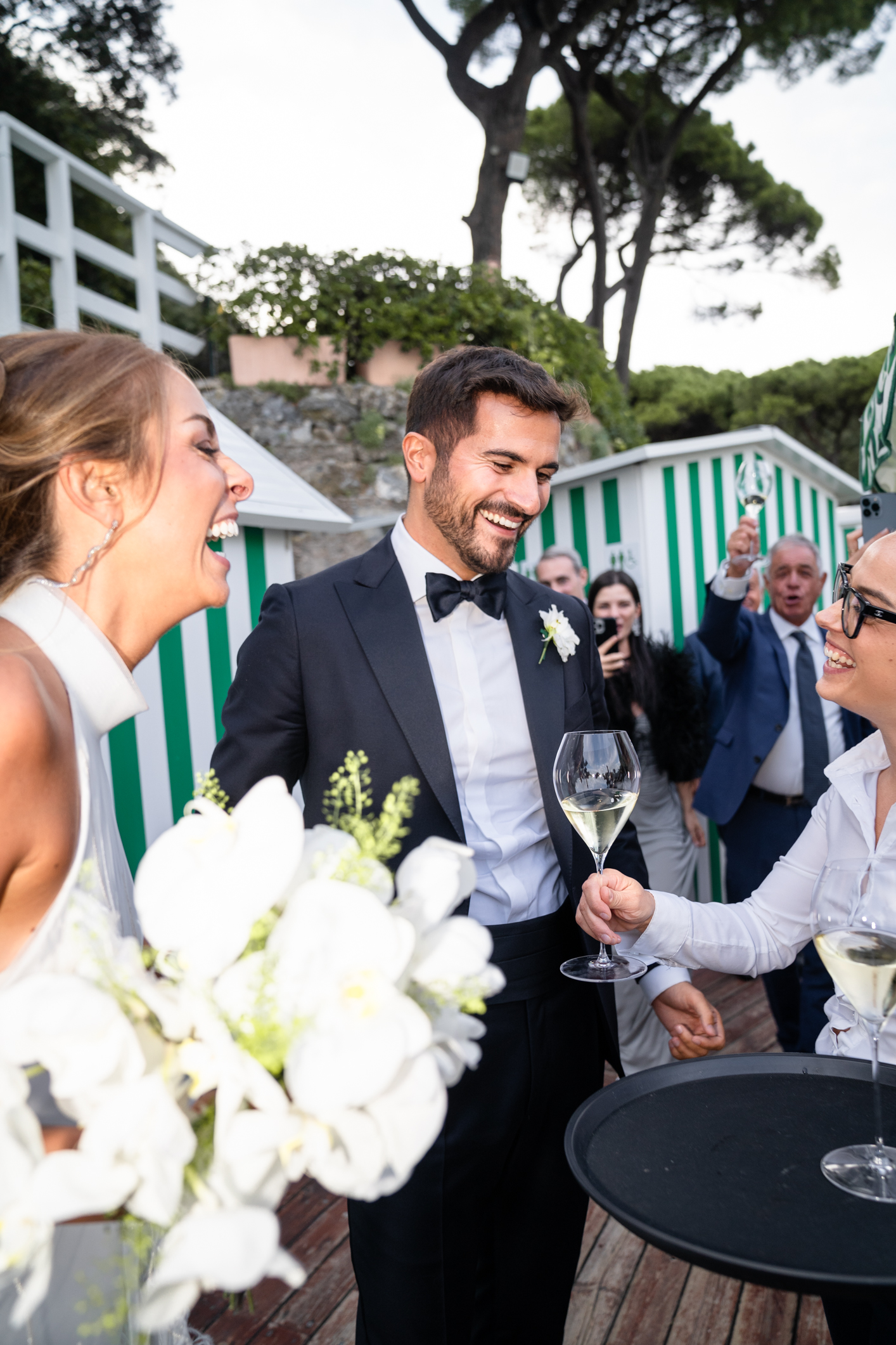 Elegant wedding in Portofino,  capturing the atmosphere of the Dolce Vita and the Italian Riviera, bride and groom' at the aperitive in one of the most luxury venue in portofino, the Vesta Portofino by Dolce e Gabbana