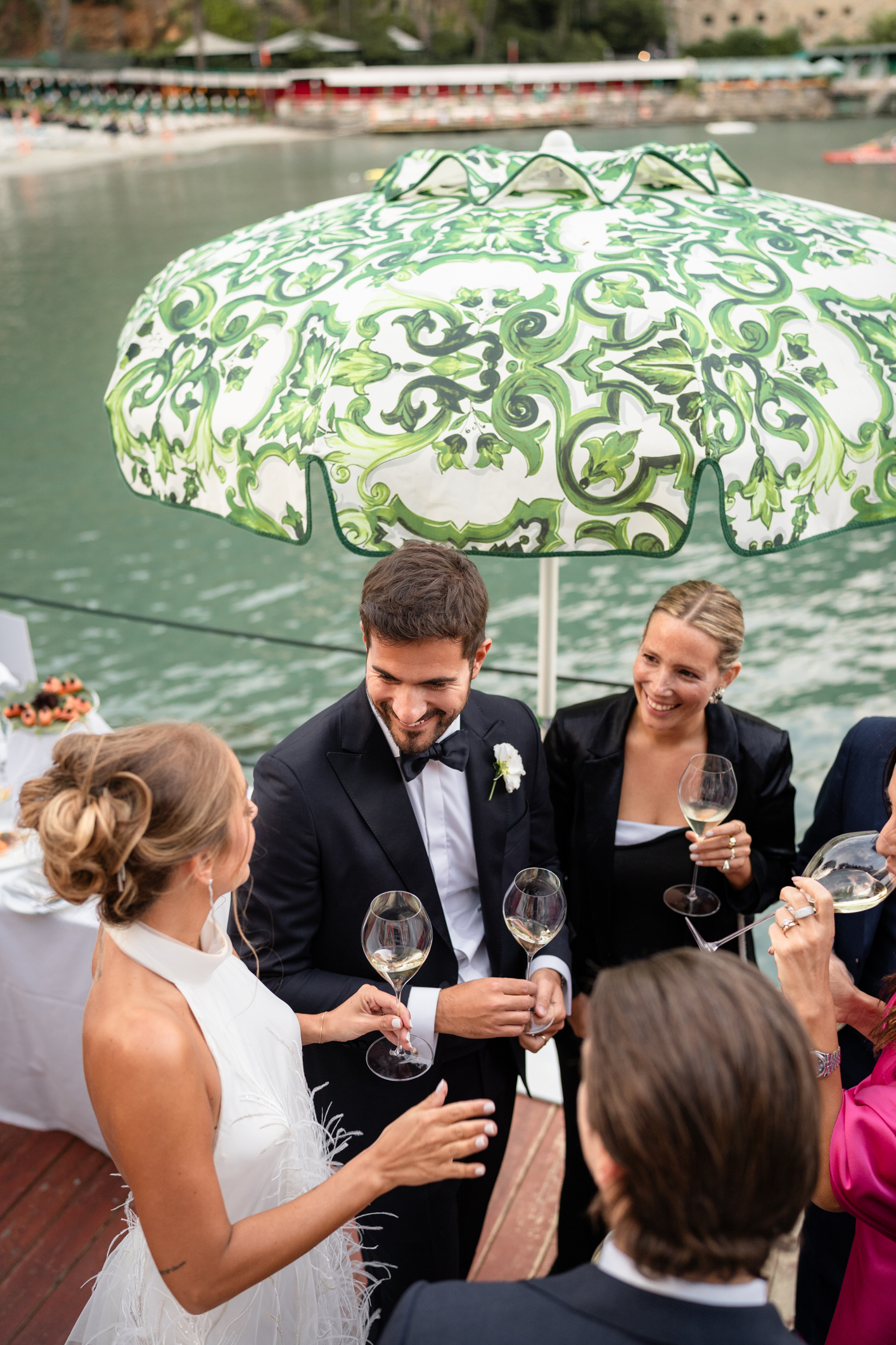 Elegant wedding in Portofino,  capturing the atmosphere of the Dolce Vita and the Italian Riviera, bride and groom' at the aperitive in one of the most luxury venue in portofino, the Vesta Portofino by Dolce e Gabbana